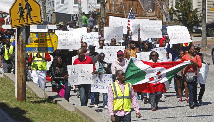 About 250 Burundi immigrants march down Congress Street in Portland on Saturday to call on the United States and other countries to help pressure the Central African nation’s president, Pierre Nkurunziza, to abandon his decision to seek a third term.