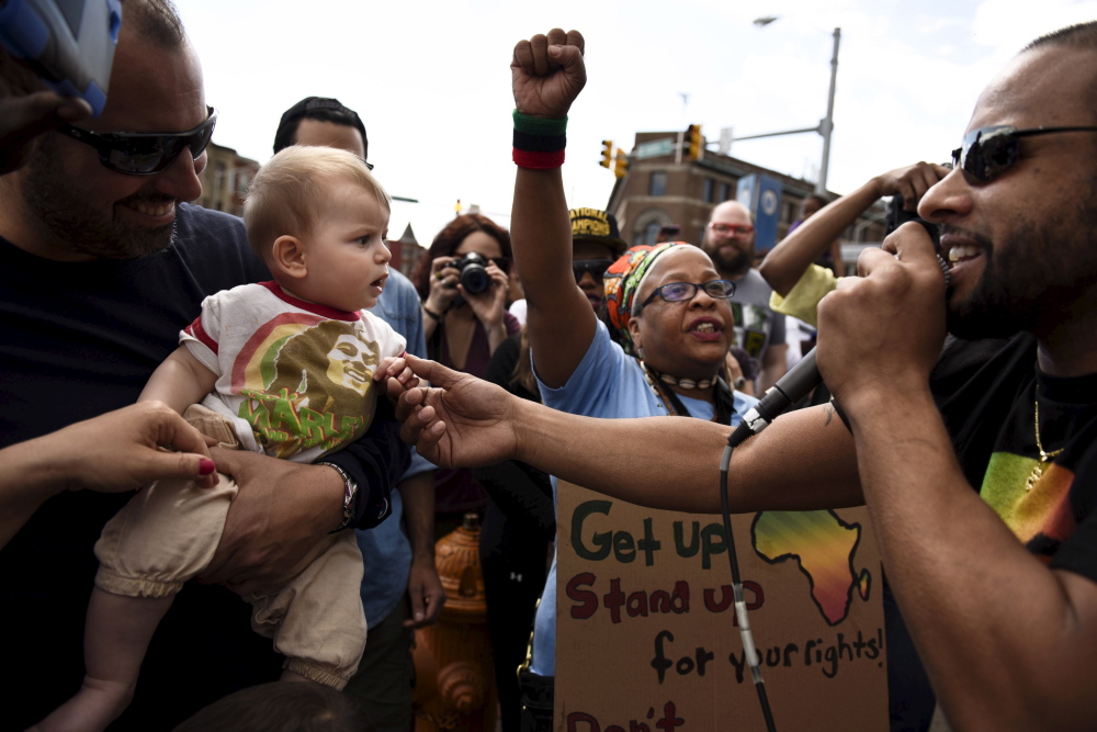 Saturday’s rally became jubilant at times with a singer interacting with a baby during a reggae performance on the streets. The Associated Press