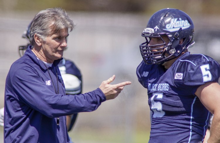 Mike Kozlakowski, right, plans after virtually a two-year wait to be back at defensive end in the fall for the University of Maine, teaming with Trevor Bates to form potentially the best tandem in the league. And if you think that thrills Coach Jack Cosgrove, left, you’d be right.