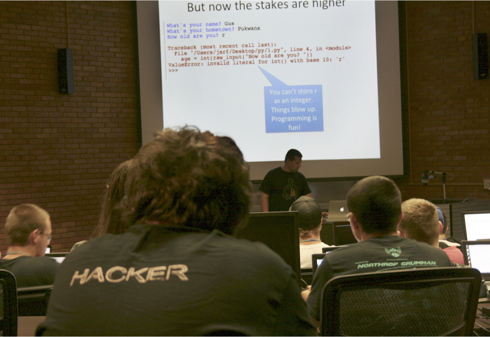 Josh Pauli teaches programming to high school students at the GenCyber Camp last summer on Dakota State University’s campus in Madison, S.D., It was one of six camps held nationally in 2014 that were funded by the National Science Foundation and National Security Agency.