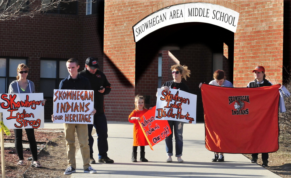 People who support keeping the “Indians” sports mascot for Skowhegan schools gather April 13 at the Skowhegan Middle School to express their opinion.
