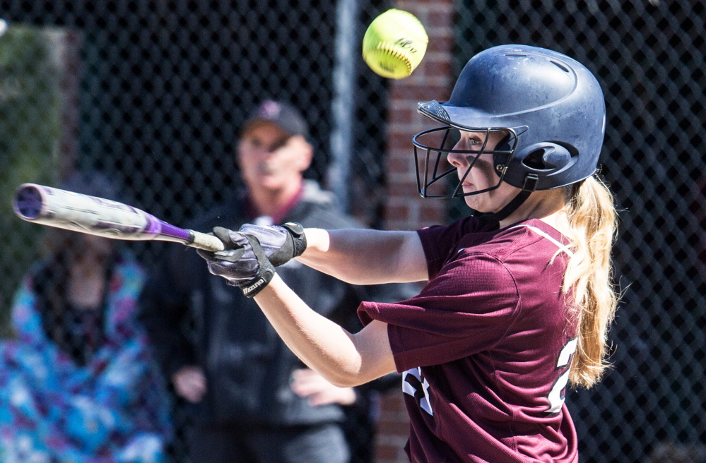 Grace McGouldrick of Gorham fouls off a pitch Saturday in an SMAA softball game against Noble. Gorham evened its record at 2-2 with a 5-2 victory.