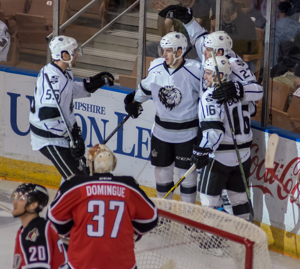 Manchester Monarchs players celebrate Michael Mersch’s goal less than two minutes into the game Saturday night against the Portland Pirates. Mersch later scored the go-ahead goal in the third period, lifting Manchester to a 5-3 win that eliminated the Pirates from the AHL playoffs.