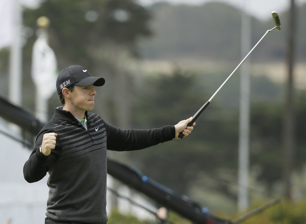 Rory McIlroy reacts after making an eagle putt on the 18th green of TPC Harding Park to win his semifinal match against Jim Furyk at the Match Play Championship golf tournament on Sunday in San Francisco.