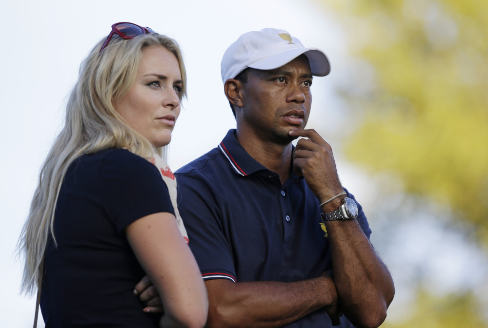 Tiger Woods watches with Lindsey Vonn at the Presidents Cup golf tournament at Muirfield Village Golf Club in Dublin, Ohio, in October 2013. Vonn announced on Sunday that she and Woods have decided to end their relationship. The Associated Press 