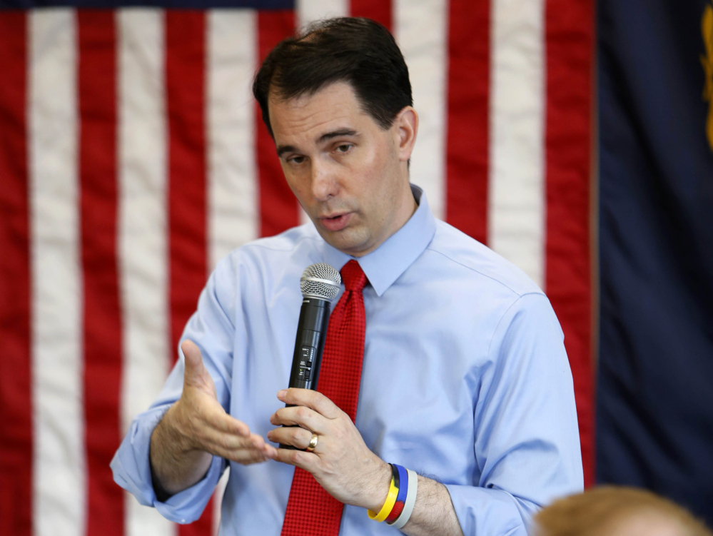 In this April 19, 2015 file photo, Wisconsin Gov. Scott Walker speaks in Derry, N.H.  Walker has emerged as a force in the 2016 White House contest.