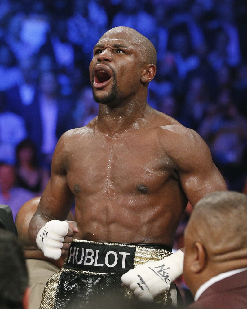 Floyd Mayweather Jr. celebrates his victory over Manny Pacquiao on Saturday night in Las Vegas. Mayweather said he’ll fight once more in September, then retire.