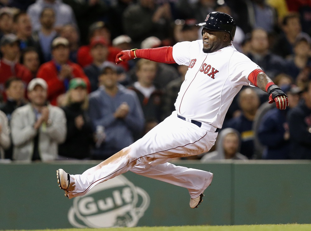 David Ortiz slides safely into home as he scores on a single by Pablo Sandoval in the sixth inning Sunday against the New York Yankees. The Red Sox nearly rallied from an 8-0 deficit, but Ortiz lined out with the bases loaded in the ninth inning to end the game.