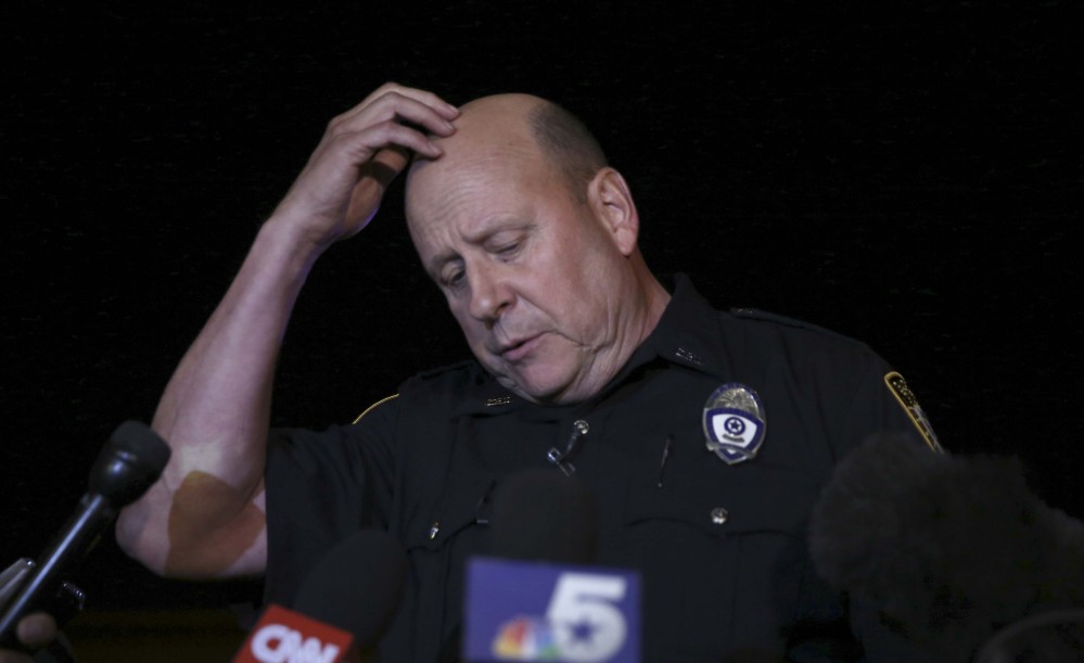 Garland Police spokesperson Joe Harn pauses as he addresses media about the shooting at the Curtis Culwell Center where a provocative contest for cartoon depictions of the Prophet Muhammad was held Sunday in Garland, Texas.