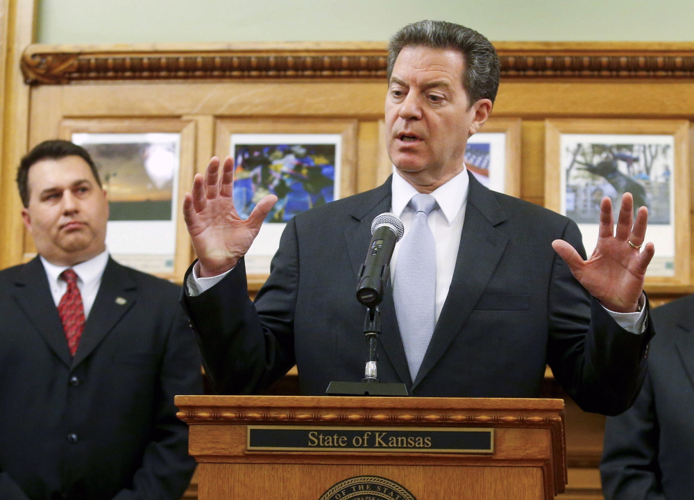 Kansas Gov. Sam Brownback says his education block grants aren’t to blame for school districts closing early as the state wrestles with tax cuts championed by Brownback.