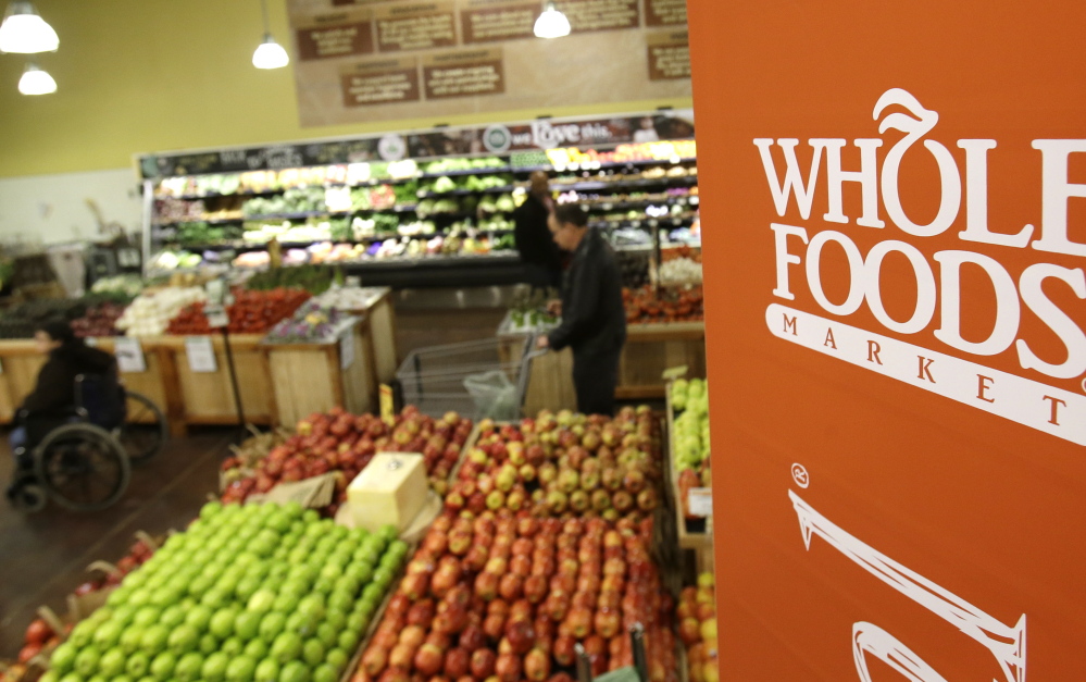 Whole Foods Market is trying to appeal to a broader audience by combating its ”Whole Paycheck” image and keeping prices down.