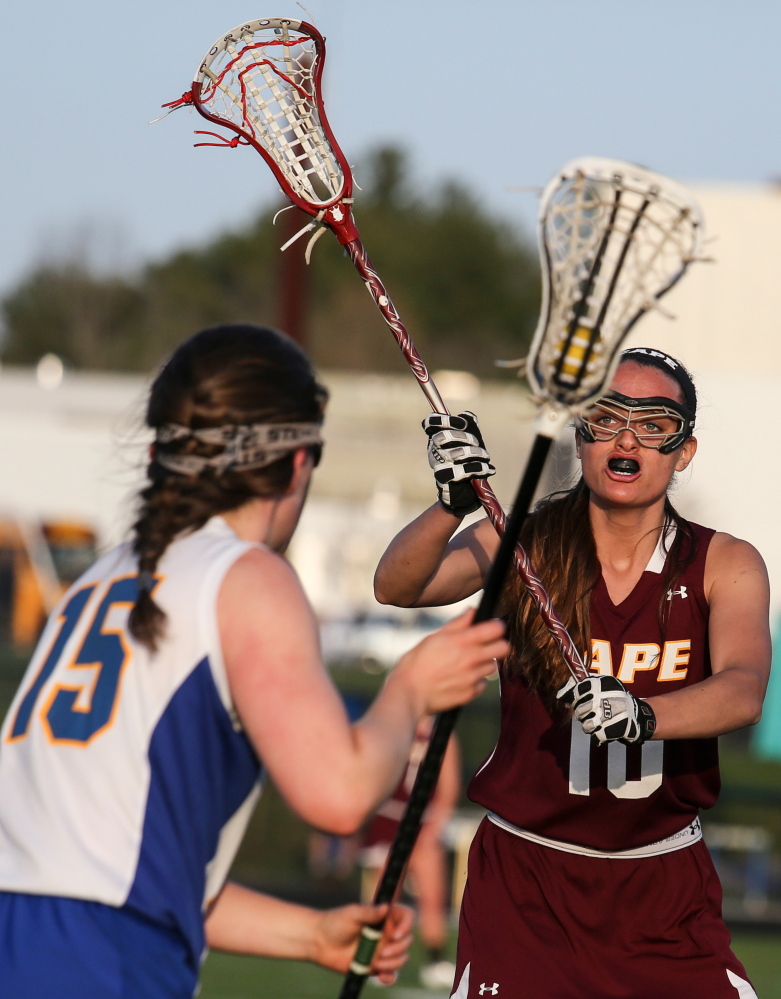 Cape Elizabeth’s Kirsten Rudberg defends as Falmouth’s Gabriel Farrell looks for an open teammate Wednesday at Falmouth High. The Capers rallied for a 7-6 win.