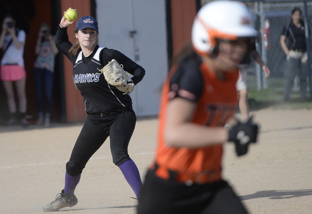 Marshwood pitcher Emily Robida fields a grounder and prepares to throw out the runner during the game at Biddeford. Biddeford improved its record in Western Class A to 5-1 and dropped Marshwood to 3-3.