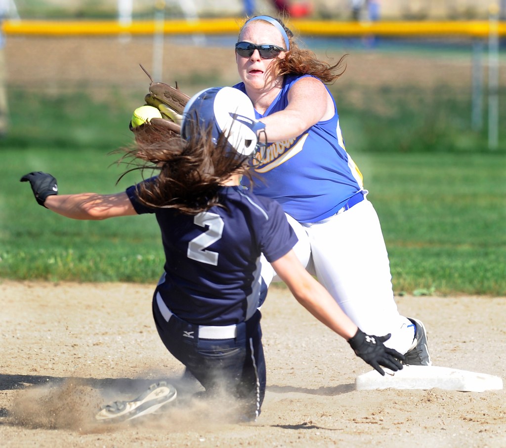 Yarmouth’s Michelle Robichaud slides toward second base as Falmouth’s Jessica Collins catches a throw from home during the Clippers’ 4-0 win Friday in Falmouth. Gordon Chibroski/Staff Photographer