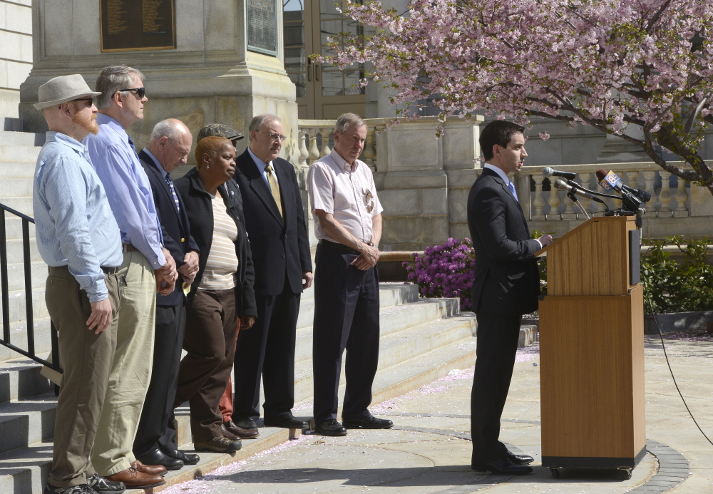 Portland City Councilor Justin Costa speaks out against racism and bigotry with other elected leaders in front of Portland City Hall on Thursday.