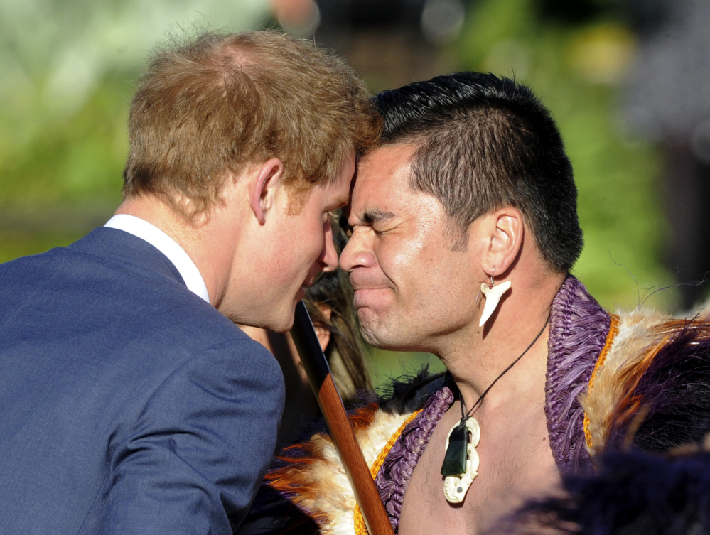 Britain’s Prince Harry receives a traditional Maori greeting from leader Thomas Vela during a welcome ceremony in Wellington, New Zealand, on Saturday.