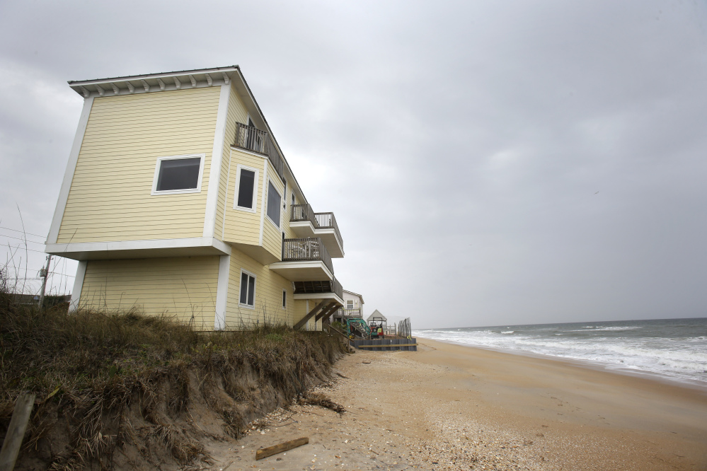 Beach erosion threatens homes, photographed in February at Vilano Beach in St. Augustine, one of many chronically flooded communities along Florida’s coast. The state is offering "no guidance’" an engineer says.
