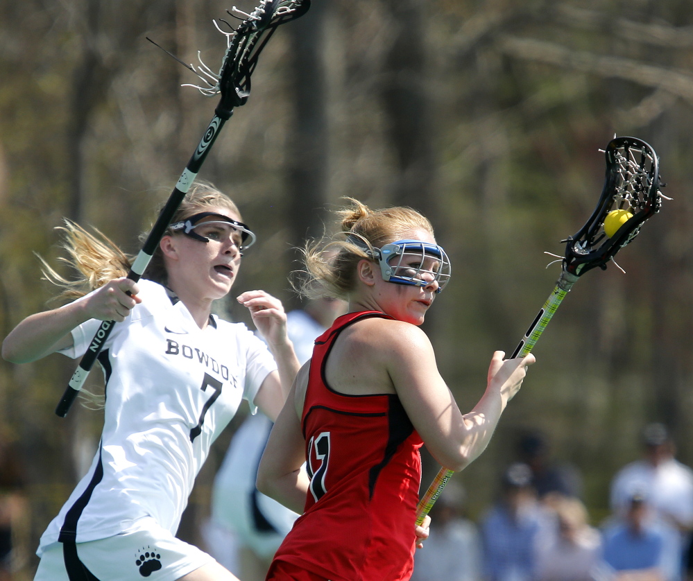 Dana White, left, of Bowdoin chases Bridgewater State’s Haley Riley during their NCAA Division III women’s lacrosse tournament game Sunday in Brunswick. Bowdoin won, 22-9.