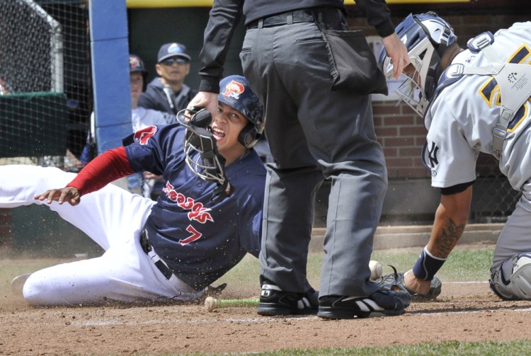 Portland’s Marco Hernandez is safe at home as Trenton’s catcher Gary Sanchez loses the ball as the Portland Sea Dogs host the Trenton Thunder at Hadlock Field in Portland on Wednesday.