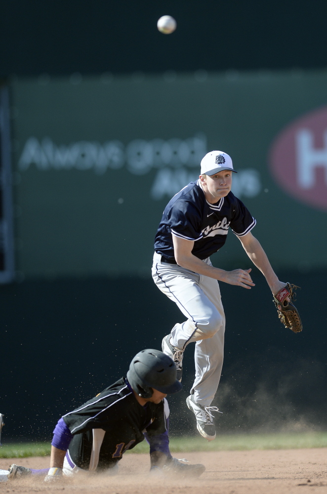 Jake Knop of Portland watches his throw to first base Thursday, completing a double play after forcing Noah McDaniel of Marshwood during Portland’s 5-0 victory at Hadlock Field.