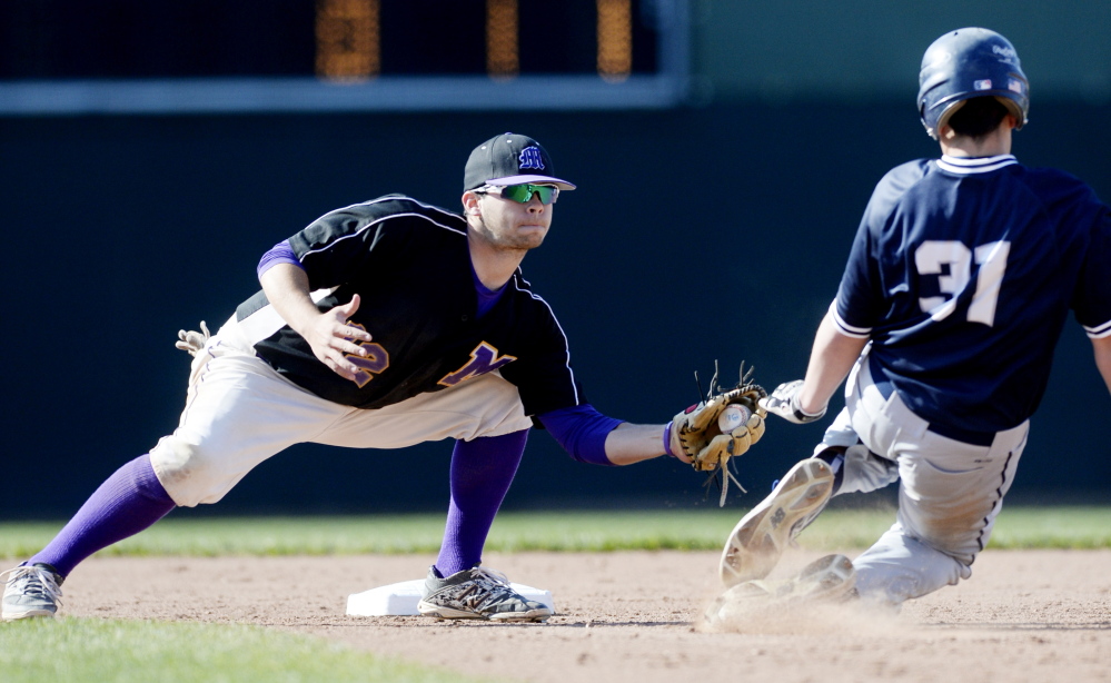 Marshwood's Noah McDaniel tags out Portland's Jack Nichols in a play at second Thursday. 
Shawn Patrick Ouellette/Staff Photographer