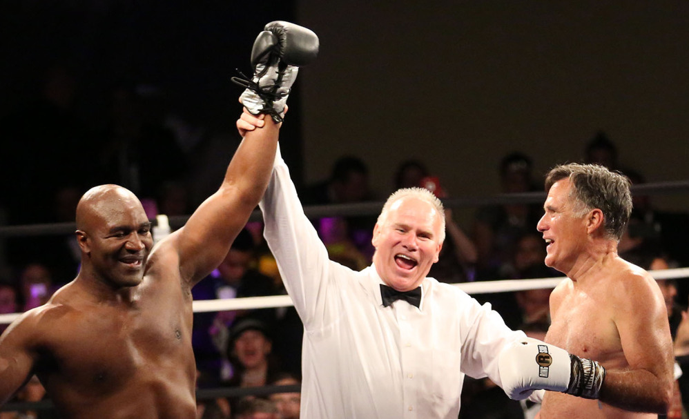 Evander Holyfield is declared winner after Mitt Romney threw in the towel after two charity rounds.