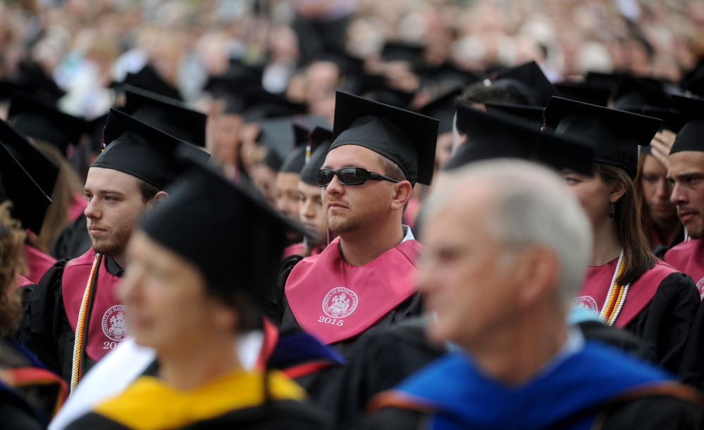 University of Maine at Farmington’s class of 2015 take their seats for commencement ceremonies in Farmington on Saturday.