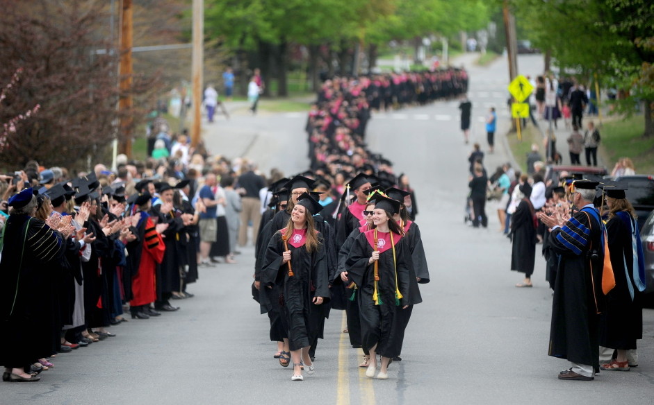 University of Maine at Farmington’s class of 2015 marches down High Street to begin commencement ceremonies in Farmington on Saturday.