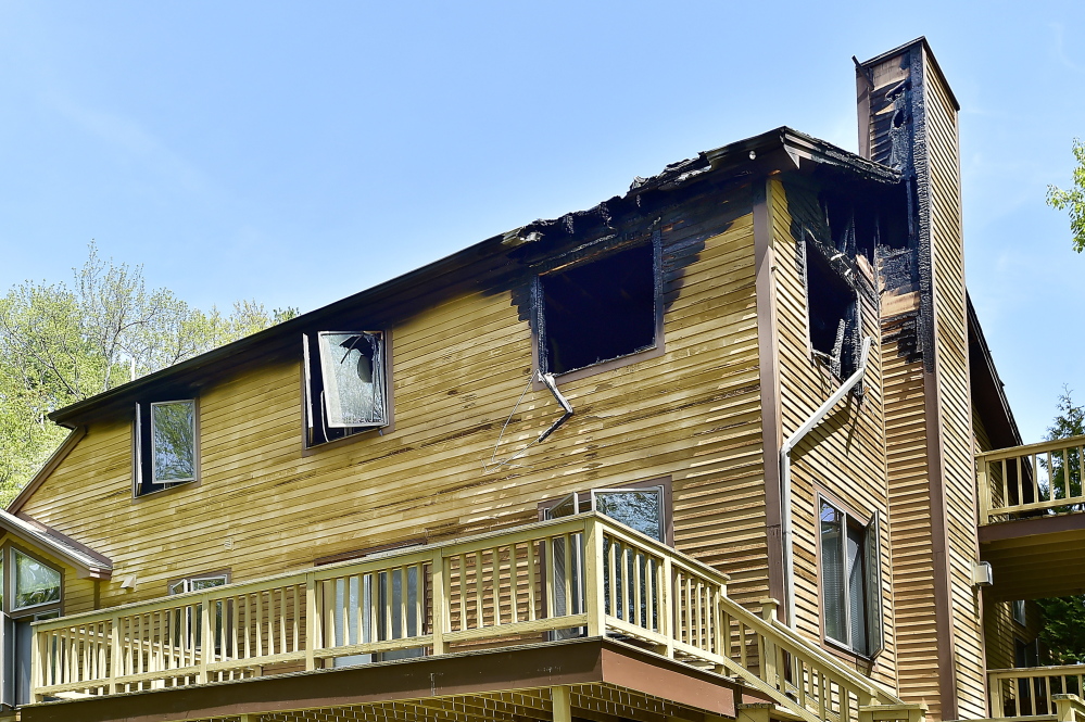 A house at 1 Victoria Lane shows damage from a fire Sunday night.
Gordon Chibroski/Staff Photographer