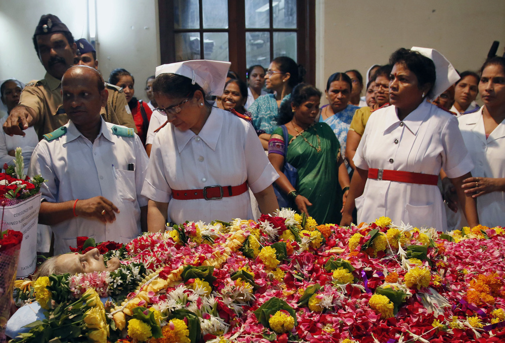Nurses gather around the body of Aruna Shanbaug during her funeral in Mumbai, India, on Monday.