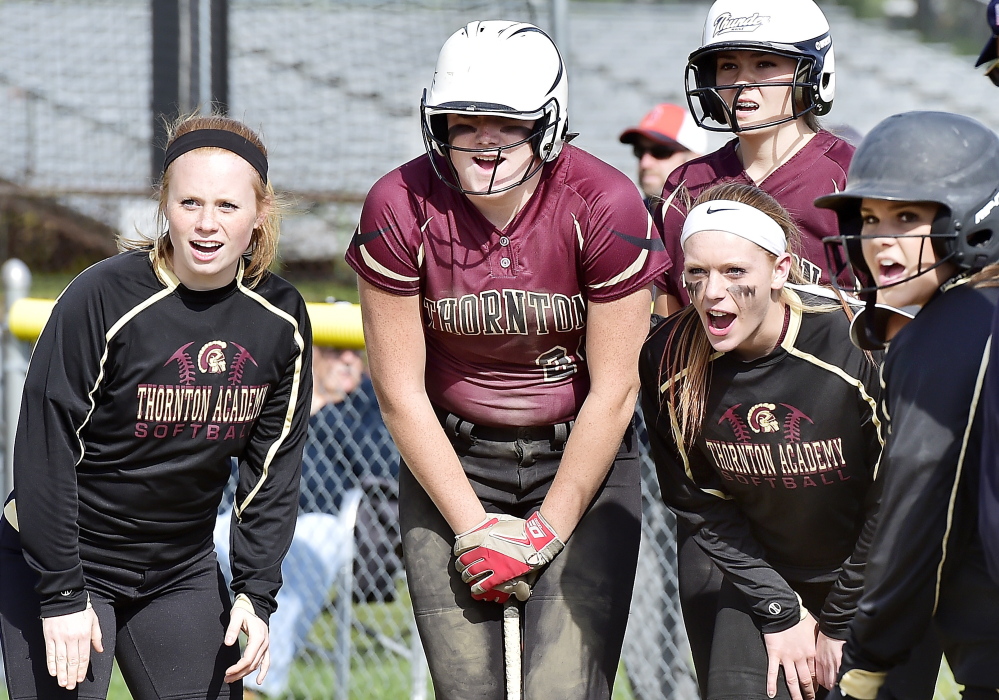 Thornton teammates cheer a home run by Libby Pomerlau in the third inning of the Trojans’ 8-2 softball win over McAuley on Monday.