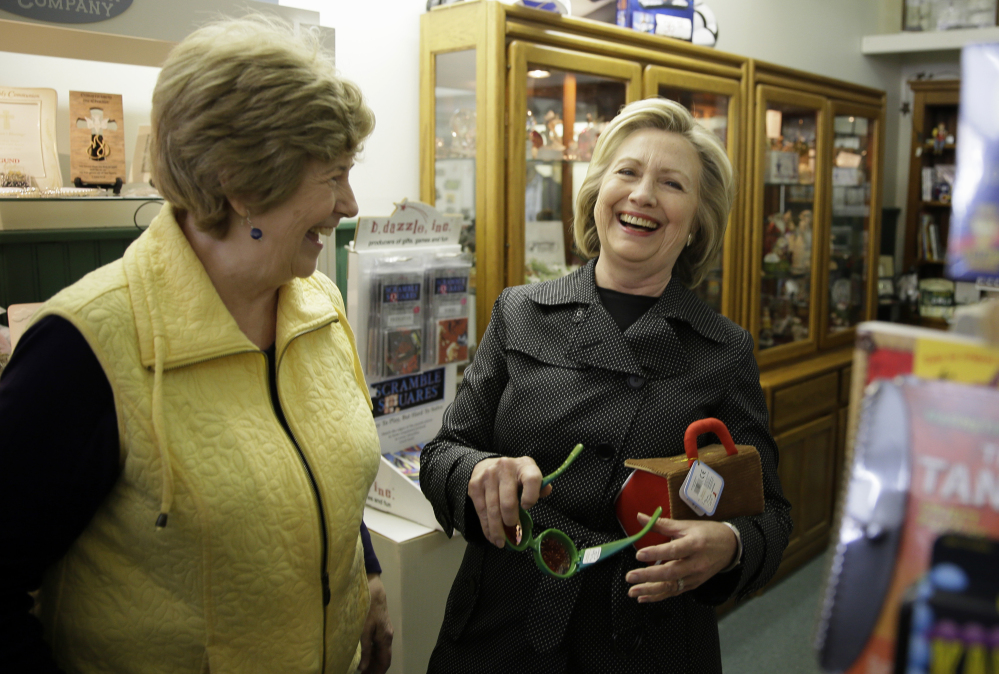 Hillary Rodham Clinton visits a toy shop in Independence, Iowa, on Tuesday. She urged the State Department to release 55,000 pages of her emails.