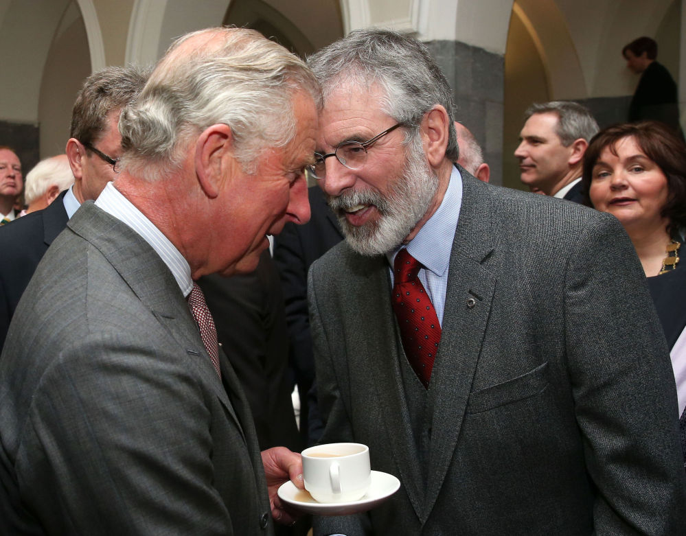 Britain’s Prince Charles  shakes hands with Sinn Fein President Gerry Adams at the National University of Ireland in Ireland on Tuesday.