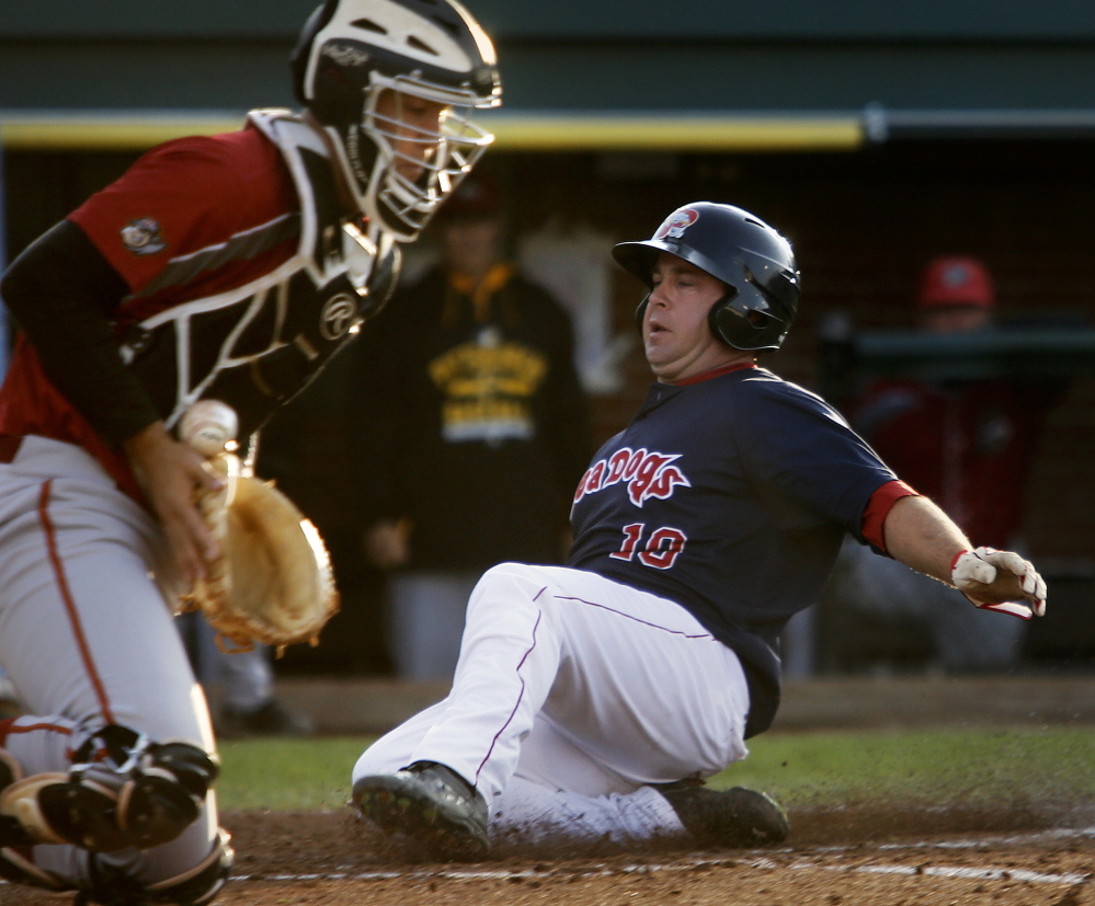 PORTLAND, ME - MAY 19: Portland Sea Dogs host Altoona. Tim Roberson of Portland scores during the second inning as the ball bounces of the glove of Jacob Stallings of Altoona. (Photo by Derek Davis/Staff Photographer)