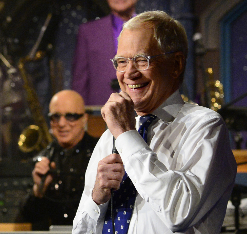 David Letterman laughs it up with band director Paul Shaffer.