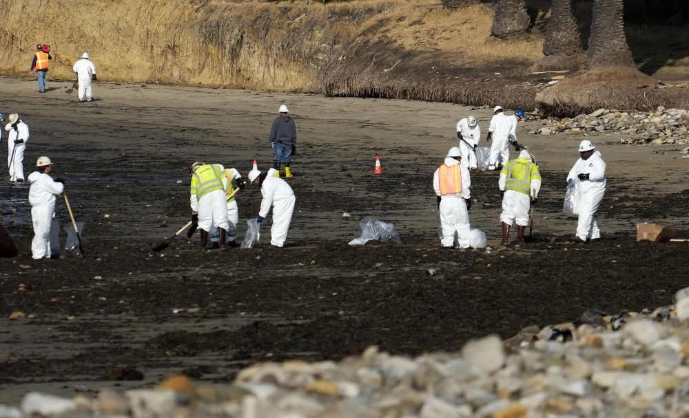Cleanup crews remove oil-laden sand on the beach at Refugio State Beach, site of an oil spill, north of Goleta, Calif., on Wednesday. 