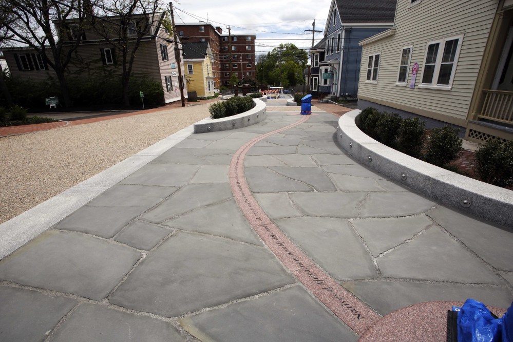 Winding through the center of the African Burying Ground Memorial Park in Portsmouth, N.H., are paving stones etched with phrases from an unsuccessful petition submitted by slaves to the New Hampshire Legislature in 1779 asking for freedom. In 2013, Gov. Maggie Hassan granted the petitioners posthumous emancipation.