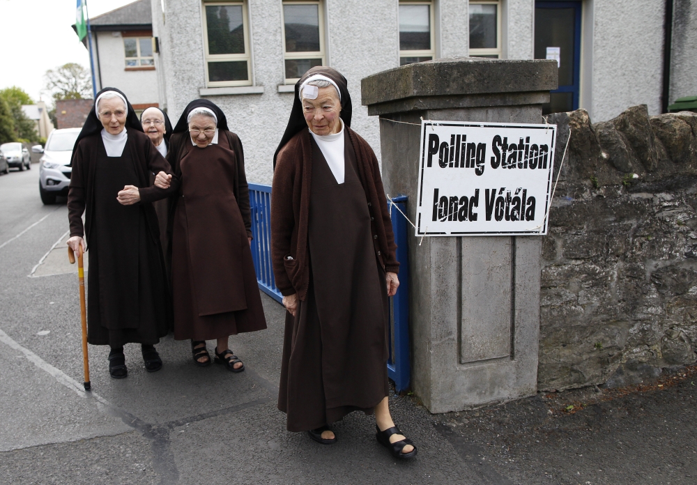 Carmelite sisters leave a polling station Friday in Malahide, County Dublin, Ireland.