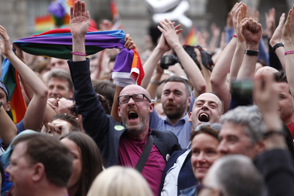 ‘Yes’ supporters celebrate at Dublin Castle on Saturday after 62 percent of Irish people approved gay marriage in the world’s first endorsement of same-sex marriage by popular vote. Welcoming the vote, Prime Minister Enda Kenny proclaims his nation is generous, compassionate, bold and joyful.