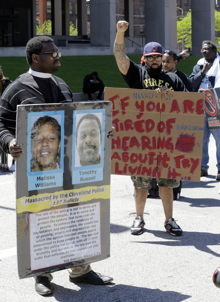 Protesters stand outside the courthouse after the Michael Brelo verdict Saturday in Cleveland.  Brelo, a police officer charged in the shooting deaths of two unarmed suspects, Timothy Russell and Malissa Williams, during a 137-shot barrage of gunfire was acquitted. He had been the only officer charged.