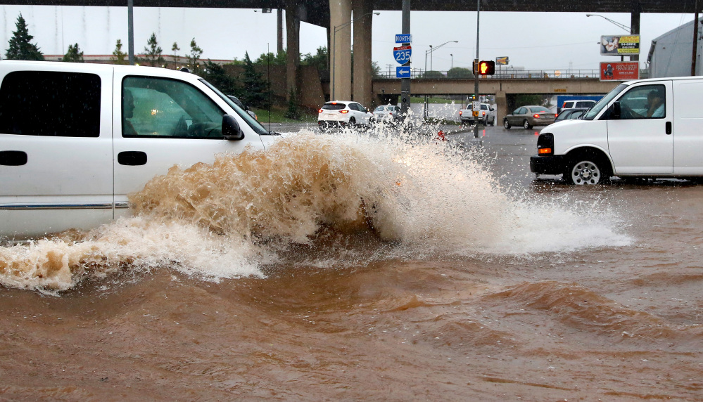 A truck forces its way through high water Saturday in Oklahoma City.