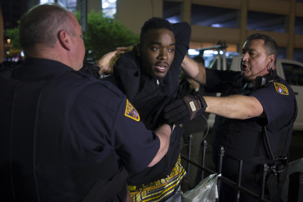 A demonstrator is arrested during a protest against the acquittal of Michael Brelo, a patrolman charged in the shooting deaths of two unarmed suspects, Saturday in Cleveland.
The Associated Press