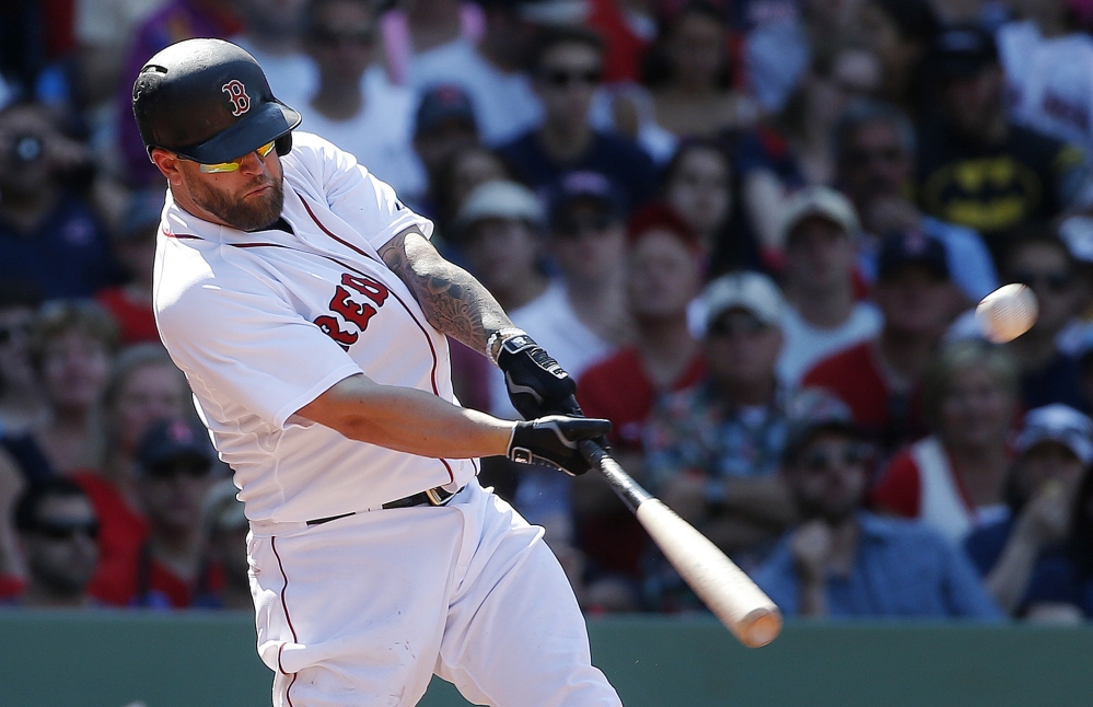 Boston’s Mike Napoli hits a two-run double in the eighth inning of the Red Sox 6-1 win over the Angels on Sunday in Boston. Napoli also hit a two-run homer run for Boston.
The Associated Press