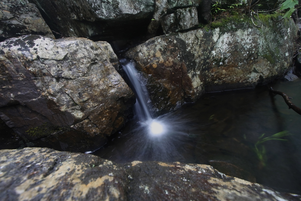 Water spills through rocks at West Chairback Pond Stream along the Appalachian Trail in Maine. Environmental groups say the federal Land and Water Conservation Fund is vital for purchasing land buffers for the trail and other parks.