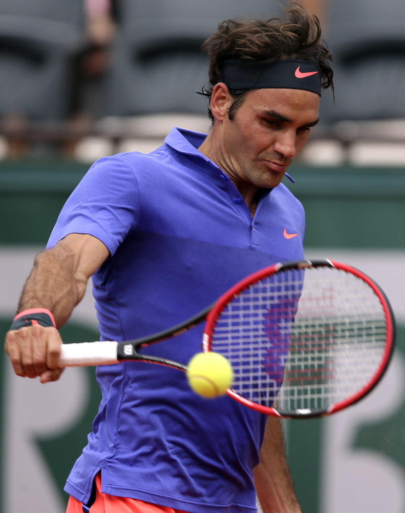 Roger Federer easily won his first-round match at the French Open on Sunday, but was bothered that security allowed a fan on the court after the match.