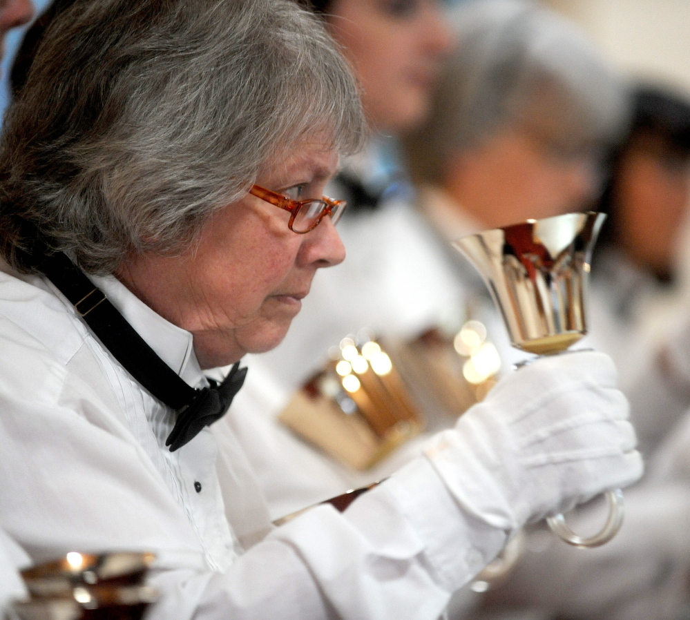 Kay Laney concentrates on ringing her bells at just the right moment in the music.
David Leaming/Morning Sentinel