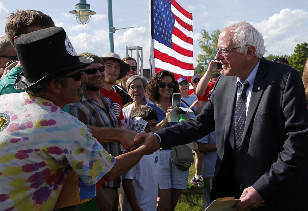 Sen. Bernie Sanders, shown greeting supporters Tuesday in Burlington, Vt., is laying out an agenda in step with the Democratic Party’s progressive wing.