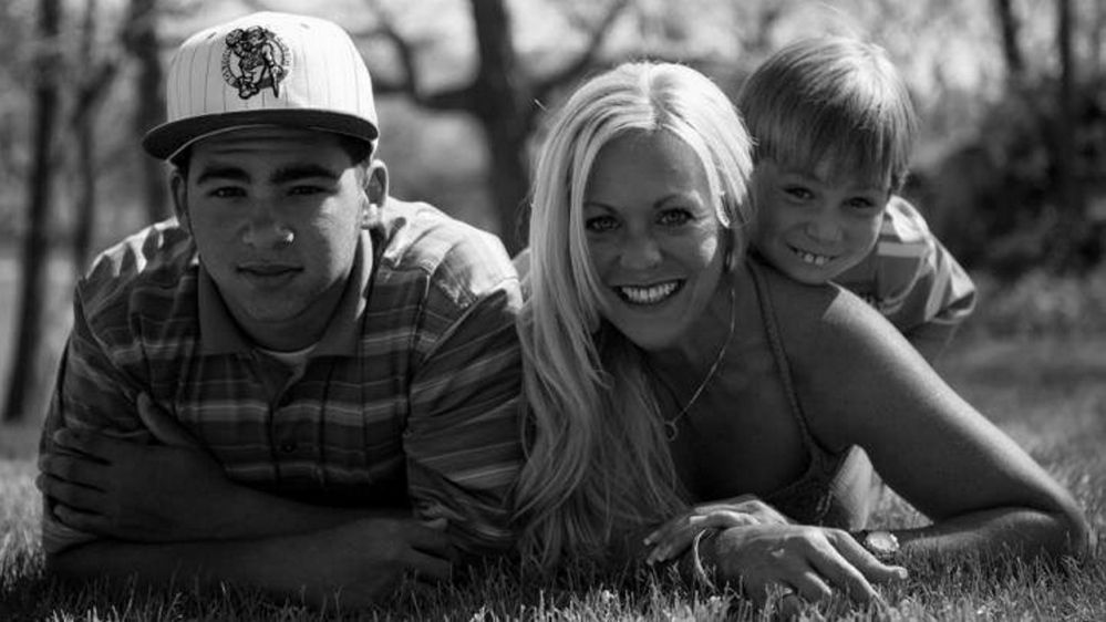 Treyjon Arsenault, left, his mother, Nancy Laxson, and his brother Ashton Laxson in 2012.