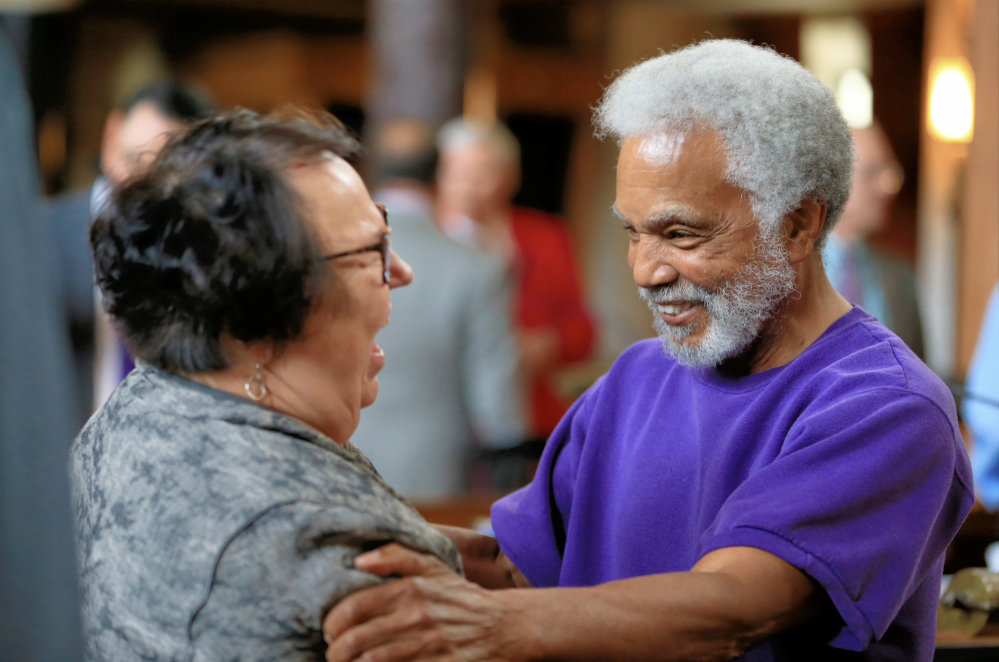 Nebraska state Sen. Ernie Chambers celebrates with Sen. Kathy Campbell after the state’s Legislature voted 30-19 to override Gov. Pete Ricketts, a Republican who supports the death penalty. The vote makes Nebraska the first traditionally conservative state to eliminate the punishment since North Dakota in 1973.