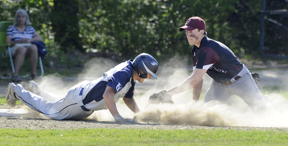 Cody Cook of Yarmouth is caught sliding into third base as Nate Cyr of Freeport applies the tag Wednesday during Freeport’s 4-0 victory in a Western Maine Conference baseball game at Freeport High.